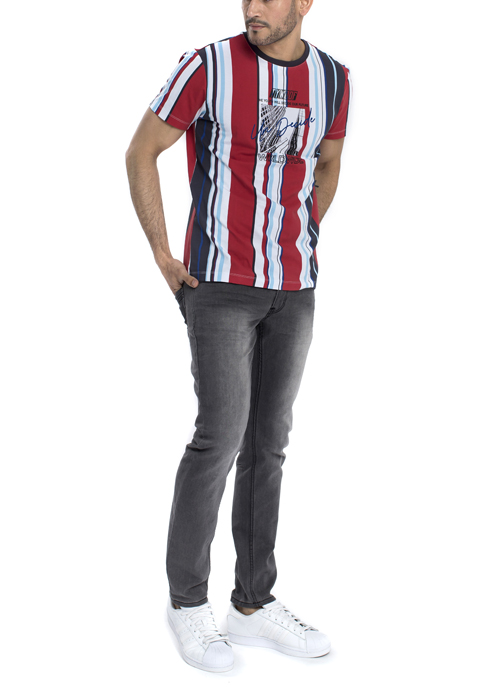 Model wearing red black and white stripe shirt with black jeans.