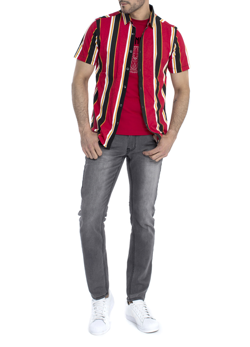 Model wearing red black and white stripe short sleeve jacket with black jeans.