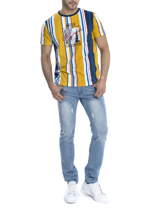 Model wearing yellow white and blue stripe shirt with blue jeans.