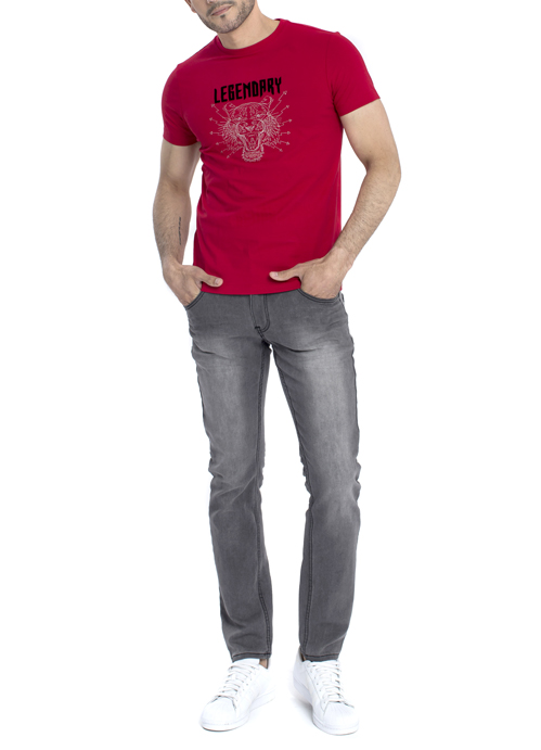 Model wearing red shirt with tiger printed design with black jeans.