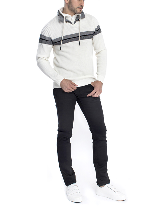 Model wearing white sweater with black skinny pants.